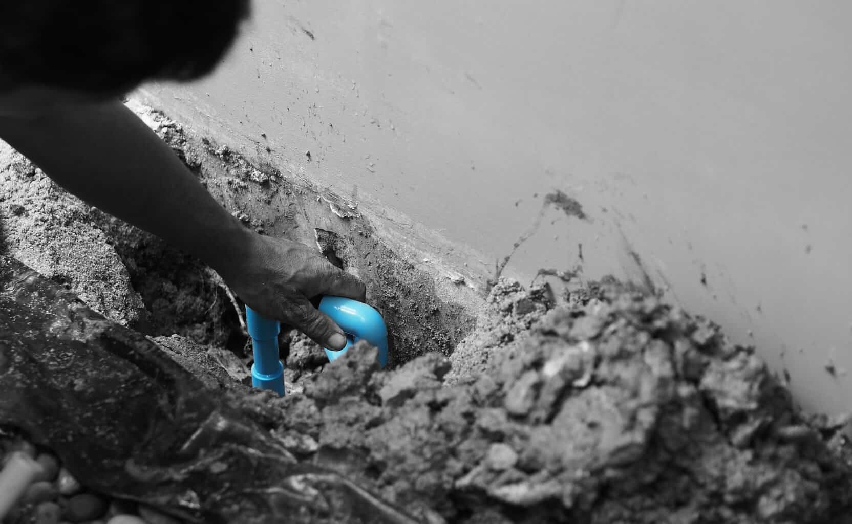 Burst Pipe Repairs Broken water pipe blue color underground in the house